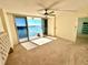 Cozy bedroom with sliding glass doors providing access to a private balcony and scenic water views at 100 Pierce St # 703, Clearwater, FL 33756