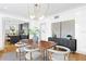 Charming dining room with modern lighting, a stylish table, and view of the kitchen at 716 14Th Ne Ave, St Petersburg, FL 33701