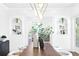 Bright dining room with a solid wood table, unique shelving, and elegant decor at 716 14Th Ne Ave, St Petersburg, FL 33701