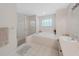 Relaxing bathroom with soaking tub, shower, and double vanity at 577 Vista Trail Ct, Palm Harbor, FL 34683