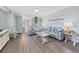 Living room with gray sofas, wood floors and a view of stairs at 577 Vista Trail Ct, Palm Harbor, FL 34683