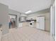 Kitchen features white cabinets, granite counters, and tile floors at 577 Vista Trail Ct, Palm Harbor, FL 34683