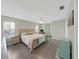 Large main bedroom with king bed, ample space, and wood floors at 577 Vista Trail Ct, Palm Harbor, FL 34683