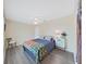 Comfortable bedroom with queen-size bed and ceiling fan at 577 Vista Trail Ct, Palm Harbor, FL 34683