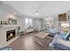 Cozy living room with fireplace and comfortable seating at 577 Vista Trail Ct, Palm Harbor, FL 34683