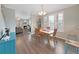 Open concept dining area with hardwood floors and access to living room at 577 Vista Trail Ct, Palm Harbor, FL 34683