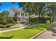 Charming two-story home with white siding and well-manicured lawn at 716 14Th Ne Ave, St Petersburg, FL 33701