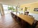 Elegant dining room with long wooden table and chairs at 100 Pierce St # 703, Clearwater, FL 33756