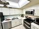 Kitchen with stainless steel appliances and white cabinetry at 100 Pierce St # 703, Clearwater, FL 33756