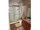 Bathroom with shower, toilet, and double vanity at 14580 Wake Robin Dr, Brooksville, FL 34604