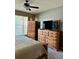 Bedroom with large wooden furniture and TV at 14580 Wake Robin Dr, Brooksville, FL 34604