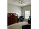 Bright bedroom with a dresser and comfy chair at 14580 Wake Robin Dr, Brooksville, FL 34604