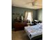 Cozy bedroom with a dresser and comfortable bed at 14580 Wake Robin Dr, Brooksville, FL 34604