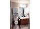 Bathroom with shower, toilet, and vanity with storage at 14580 Wake Robin Dr, Brooksville, FL 34604