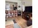 Spacious living room with hardwood floors, a bar, and comfortable seating at 14580 Wake Robin Dr, Brooksville, FL 34604
