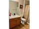 Clean bathroom with wood floor and shower/tub at 14580 Wake Robin Dr, Brooksville, FL 34604
