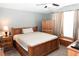Bedroom with wooden furniture and window coverings at 14580 Wake Robin Dr, Brooksville, FL 34604