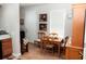 Cozy dining area with a wooden table and chairs, situated near a kitchen at 14580 Wake Robin Dr, Brooksville, FL 34604
