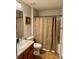 Clean bathroom with wood floor and shower/tub at 14580 Wake Robin Dr, Brooksville, FL 34604