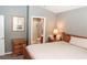 Bedroom with ensuite bathroom and wooden furniture at 14580 Wake Robin Dr, Brooksville, FL 34604