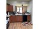 Bright kitchen features ample cabinetry, modern appliances, and tile flooring at 14580 Wake Robin Dr, Brooksville, FL 34604