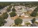 Aerial view of a residential neighborhood with houses and well-maintained lawns at 14580 Wake Robin Dr, Brooksville, FL 34604