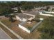 Backyard with patio, shade sail, and fenced enclosure at 14580 Wake Robin Dr, Brooksville, FL 34604