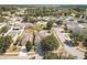 Wide aerial view of a residential neighborhood with various houses at 14580 Wake Robin Dr, Brooksville, FL 34604