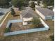 Backyard with patio, shade sail, and fenced enclosure at 14580 Wake Robin Dr, Brooksville, FL 34604