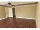 Spacious bedroom with wood-look flooring at 1704 Lago Vista Blvd, Palm Harbor, FL 34685