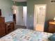 Bedroom with view into bathroom and adjacent room at 1375 Doolittle Ln # 201, Dunedin, FL 34698