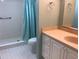 Clean bathroom with shower/tub combo and vanity at 1375 Doolittle Ln # 201, Dunedin, FL 34698