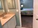 Bathroom with single sink vanity, shower, and toilet at 1375 Doolittle Ln # 201, Dunedin, FL 34698