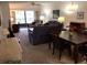 Spacious living room with dining area and balcony access at 1375 Doolittle Ln # 201, Dunedin, FL 34698