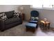 Living area with love seat, rocking chair, and side tables at 1375 Doolittle Ln # 201, Dunedin, FL 34698