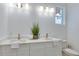 Bright Primary bathroom with double sinks, quartz countertops, and modern gold fixtures at 316 11Th N Ave, St Petersburg, FL 33701