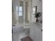 Bathroom with shower over tub, modern fixtures, and a white vanity with stylish mirror at 316 11Th N Ave, St Petersburg, FL 33701