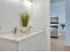 Bathroom featuring a double sink vanity with white cabinets, marble countertops, and contemporary decor at 316 11Th N Ave, St Petersburg, FL 33701