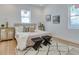 Bright bedroom with light wood floors, a cozy rug, and stylish decor creating a relaxing space at 316 11Th N Ave, St Petersburg, FL 33701