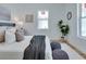 Sunlit bedroom boasting wood floors, contemporary decor, and a peaceful ambiance near a large window at 316 11Th N Ave, St Petersburg, FL 33701