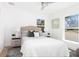 Bright bedroom features a neutral color palette, plush bedding, bedside tables, and large windows at 316 11Th N Ave, St Petersburg, FL 33701