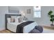 Comfortable bedroom featuring stylish grey furnishings and a cozy window nook filled with lots of natural light at 316 11Th N Ave, St Petersburg, FL 33701