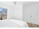 Bright bedroom offers a neutral color palette, plush bedding, closet, and large windows that provide natural light at 316 11Th N Ave, St Petersburg, FL 33701