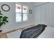 Inviting bedroom with light wood floors, a cozy rug, and ample natural light from a large window at 316 11Th N Ave, St Petersburg, FL 33701