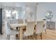 Bright dining area showcases modern lighting, hardwood floors, and an open-concept living space at 316 11Th N Ave, St Petersburg, FL 33701