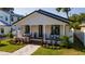Inviting single-story home with a manicured lawn and stylish front porch at 316 11Th N Ave, St Petersburg, FL 33701