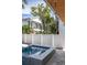 Relaxing backyard featuring a modern hot tub and outdoor shower, surrounded by lush greenery and stylish architecture at 316 11Th N Ave, St Petersburg, FL 33701