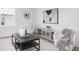 Bright living room offers a plush armchair, stylish cabinet, soft rug, creating a cozy and inviting atmosphere at 316 11Th N Ave, St Petersburg, FL 33701