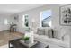Bright living room with hardwood floors, modern decor, and plush seating offering a welcoming and stylish interior at 316 11Th N Ave, St Petersburg, FL 33701