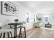 Bright living room with a kitchen dining area, hardwood floors, modern decor, creating a cozy and inviting atmosphere at 316 11Th N Ave, St Petersburg, FL 33701